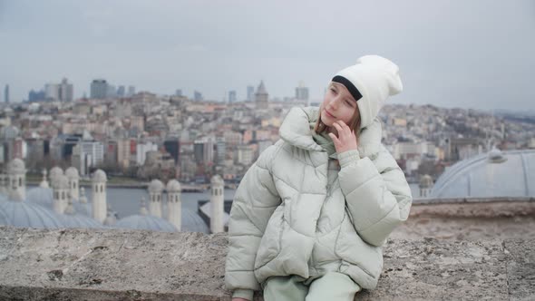 European Tourist Woman Posing on Suleymaniye Mosque and Building Roofs Landscape in Turkish Istanbul