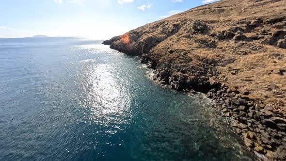 FPV Racing Drone Mountain Surfing and Cliff Diving Along the Rocks