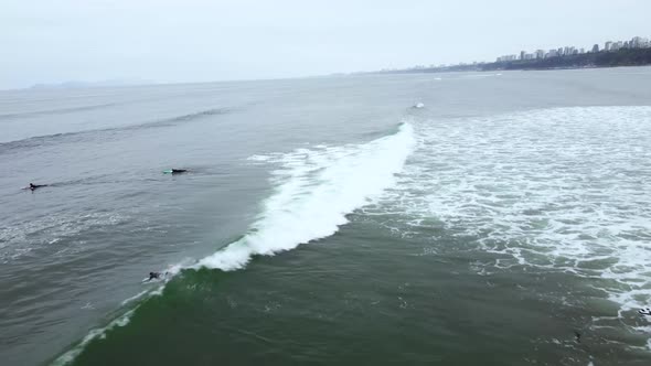 Drone Aerial View of Surfers in Beach Miraflores, Lima-Peru.