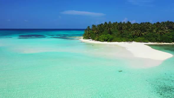 Aerial drone shot landscape of marine lagoon beach adventure by blue lagoon with clean sand backgrou