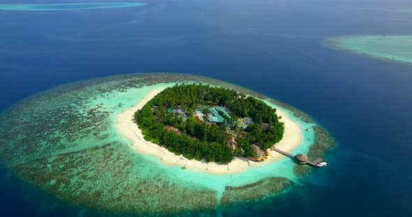 erial drone view of scenic tropical islands in the Maldives.