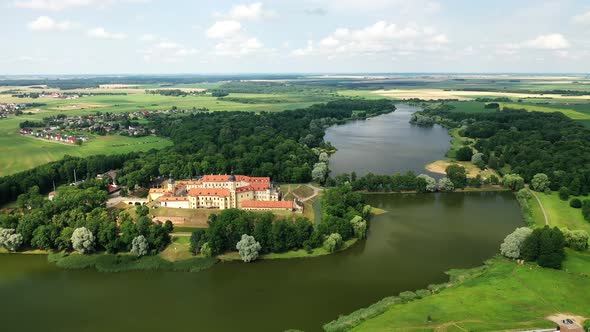 Flying Over the Nesvizh Castle the Park Around the Castle and the Lake Aerial Video of Nesvizh