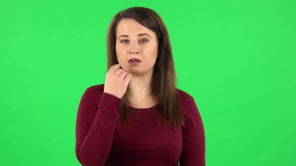 Portrait of Pretty Girl Smiling and Showing Heart with Fingers Then Blowing Kiss, Green Screen