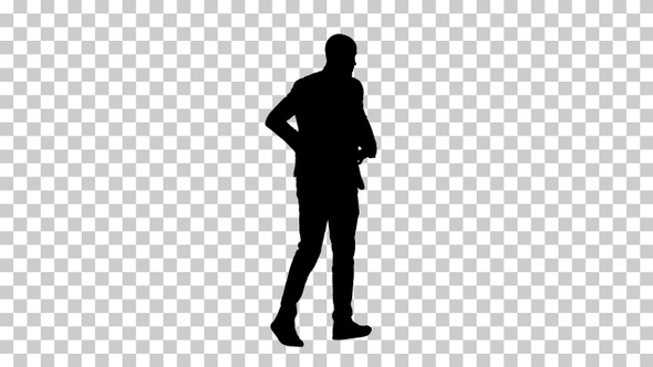 Silhouette Casual man putting blazer on It is getting cold