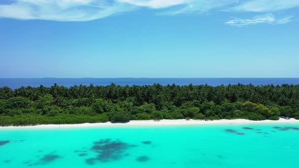 Natural aerial copy space shot of a paradise sunny white sand beach and blue water background in col