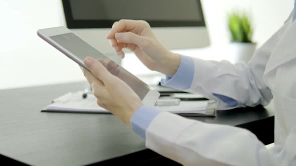 Doctor Using Tablet