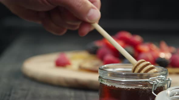 Dipper in Jar of Honey