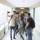Group of students taking selfie with smartphone in corridor - VideoHive Item for Sale