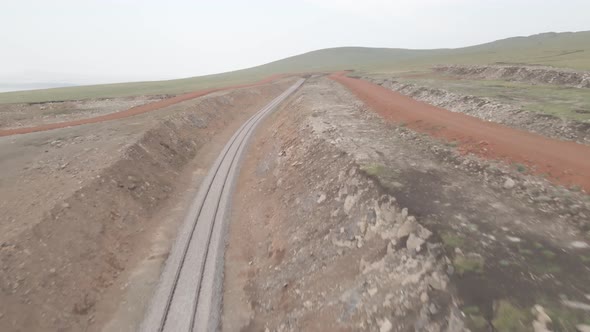 Moving along railroad tracks. Aerial view of Railroad emergency stop track in Trialeti, Georgia