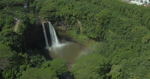 4k aerial pan over Wailua Falls with rainbow in Kauai