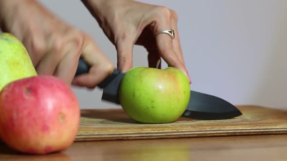 Woman Cuts The Apple In Half