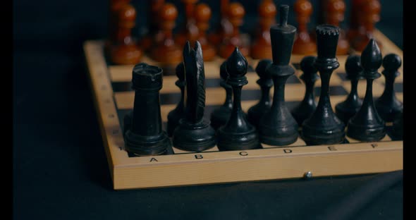 Close Up of Wooden Black Chess Pieces on Chessboard