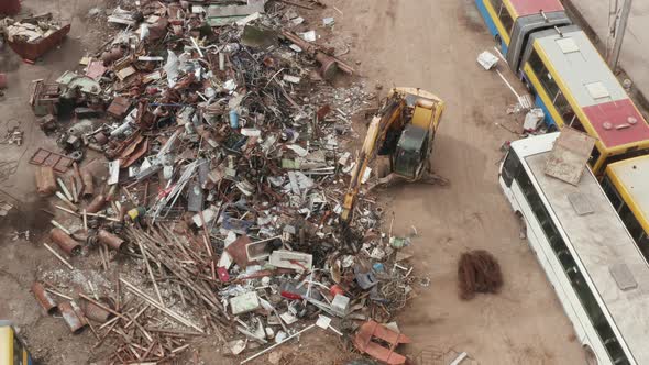 Metal Scrap Waste Pile at Recycle Center With Bulldozer Sorting Used Auto Parts