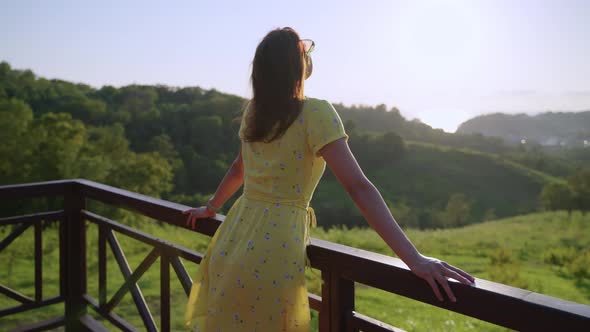 Young Carefree Lady is Spending Summer Vacation in Modern Hotel in Mountain