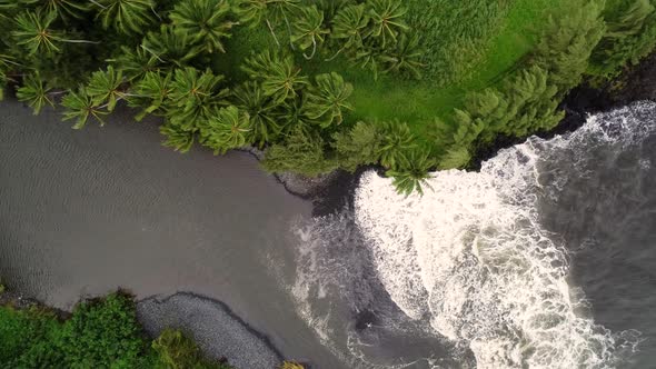 Aerial view of river water encountering agitated ocean, Hawaii, U.S.A.