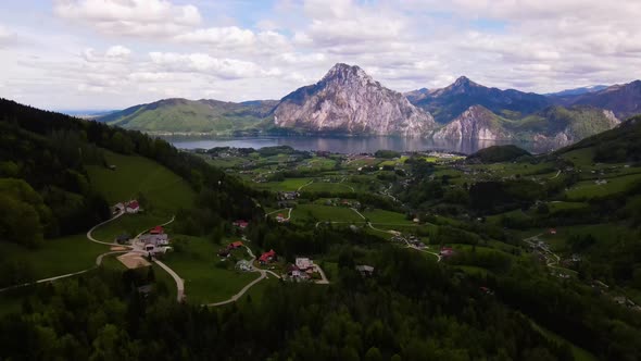 Beautiful view on the Mountains, lake and a Village Drone Video