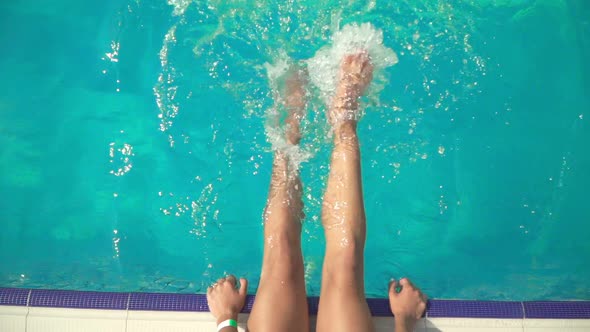 Slim Female Legs Splash in Pool on Hot Summer Day Bikini Girl Relaxing in Swimming Pool in Sunny Day