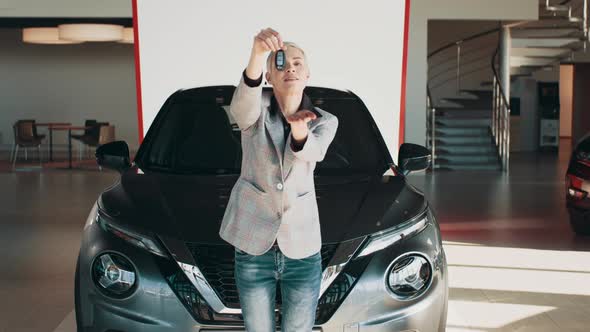 Portrait of Happy Adult Successful Proud Woman Posing in Auto Showroom Buying