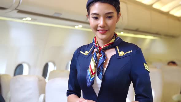 Cabin Crew or Air Hostess Working in Airplane