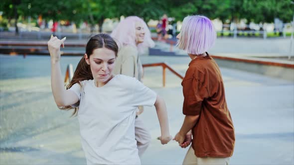 Young Dancing Teenager Girls Enjoying Funky Hip-hop Moves. Modern Women Performing Freestyle Dance