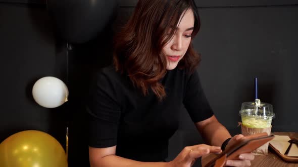 slow-motion of woman using smartphone in the cafe