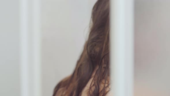 Cute Caucasian Woman Taking a Shower at Home or at the Hotel