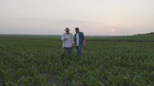 Two Farmers Walk and Shake Their Hands