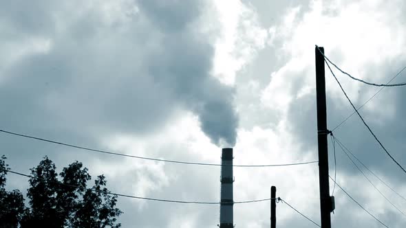 Large Pipe of Smoke Pipe Thermal Power Plant in Light on a Sunny Day