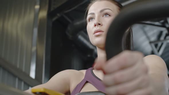 Woman Working Out Chest Muscles