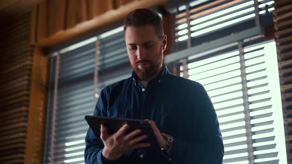 Businessman checking bitcoin price chart on digital exchange on mobile phone screen, cryptocurrency