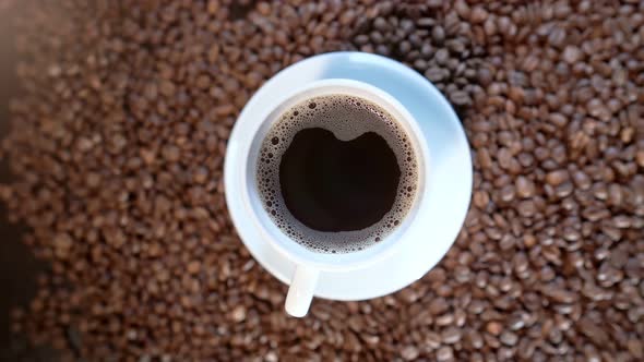 A Rotating Video of a Cup Full of Dark Fragrant Espresso Coffee