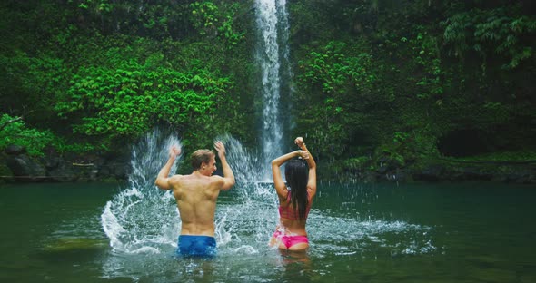 Couple Enjoying Waterfall