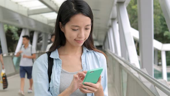 Woman use of mobile phone at outdoor