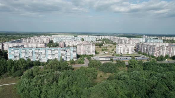 Aerial View MultiStorey Buildings Near Green Forest in Residential Area at City