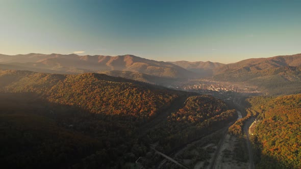 Aerial Drone Flight Over Landscape in Mountain Valley with Ukrainian Village in Carpathians Western