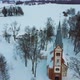 Aerial Top View of the Krimulda Evangelic Lutheran Church in Winter at Sunrise Latvia 4k Video - VideoHive Item for Sale