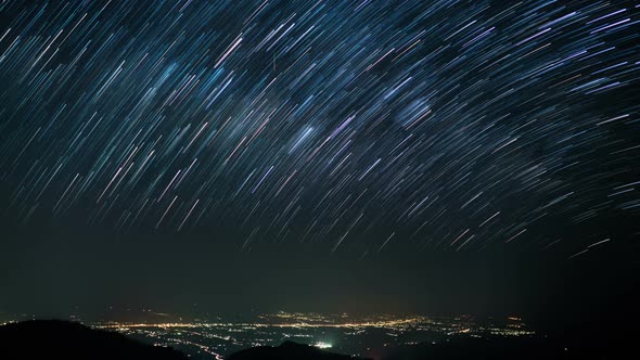 Star Trails In Night Sky With Lights City