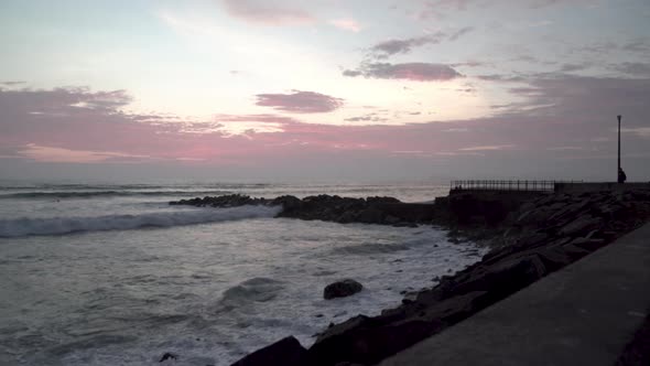 Sunset and clouded sky over sea and jetty on Miraflores, Lima, Perú