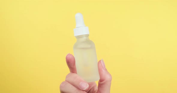Serum in glass bottle