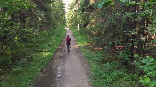 Young Cyclist Riding on a Nice Road