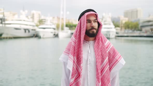 Arab Male Looking Away in Harbor