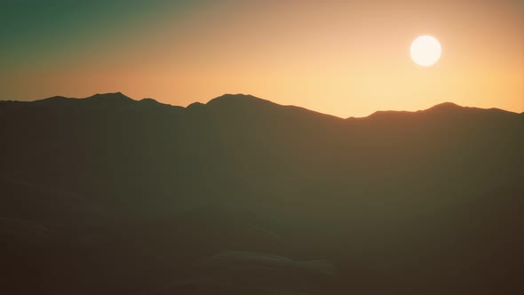 Hills with Rocks at Sunset