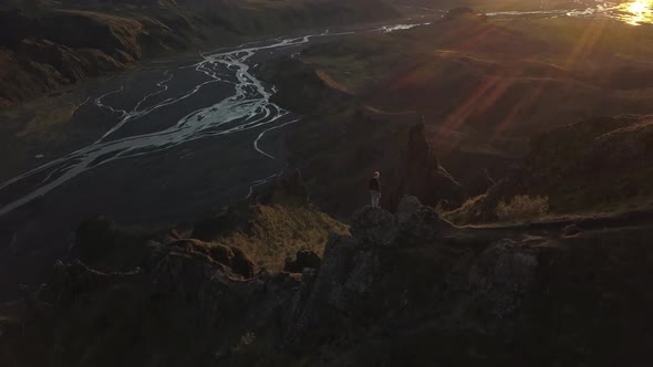 Slow Pitch Motion Of Hiker On Top Of A Mountain In Iceland During Sunset