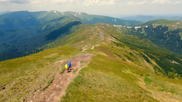 Two Tourists Descend the Montenegrin Ridge