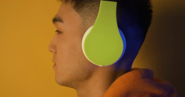 Young Man Listening To Music with Headphones