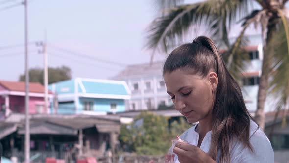 Young Pretty Brunette Takes Watermelon From Plastic Bag