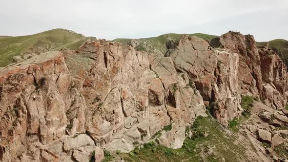 A Man Climbs Up the Cliff