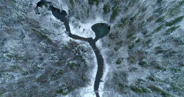 Holy Sacred Spring Water Lake and River in Winter Forest Aerial View