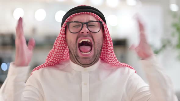 Upset Young Arab Businessman Shouting Screaming