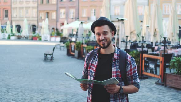 Zoom Shot of Trendy Young Tourist with Map Smiling To the Camera